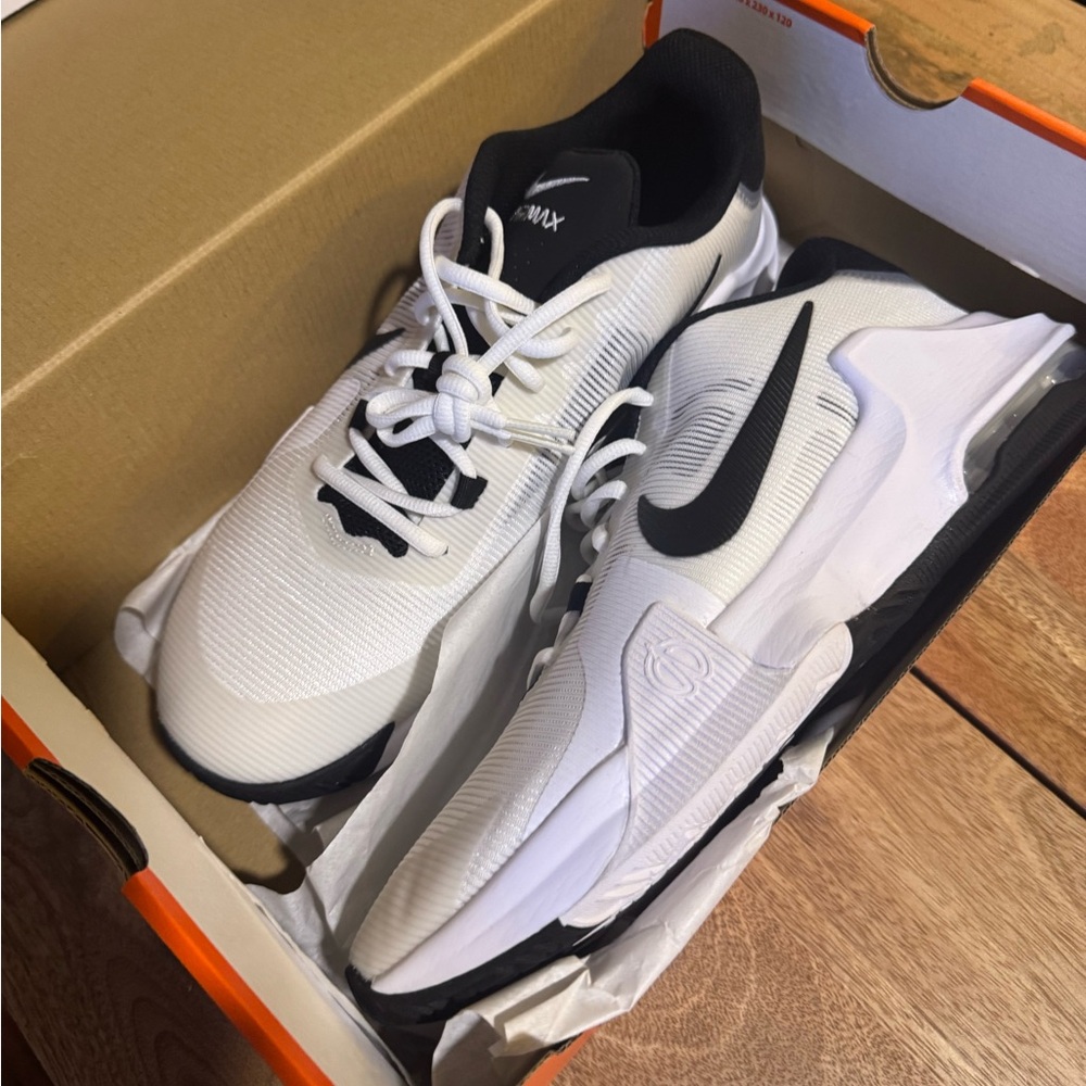 Nike Air Max Impact 4
White and Black Athletic Shoes